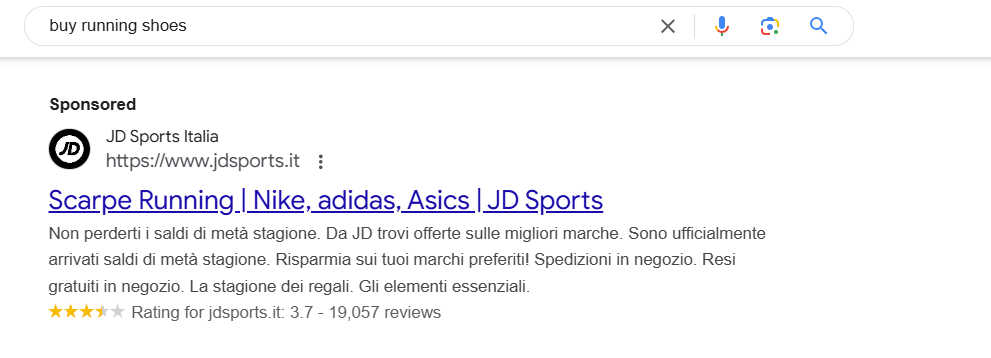 an image showing paid search results for the query "buy running shoes" that will be used in a serp analysis
